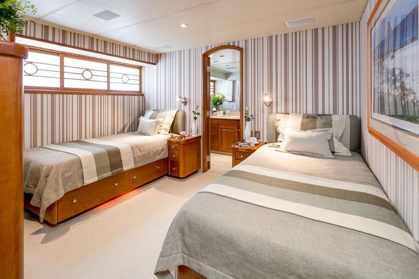 a couple of beds in a hotel room aboard DAYDREAM Yacht for Sale