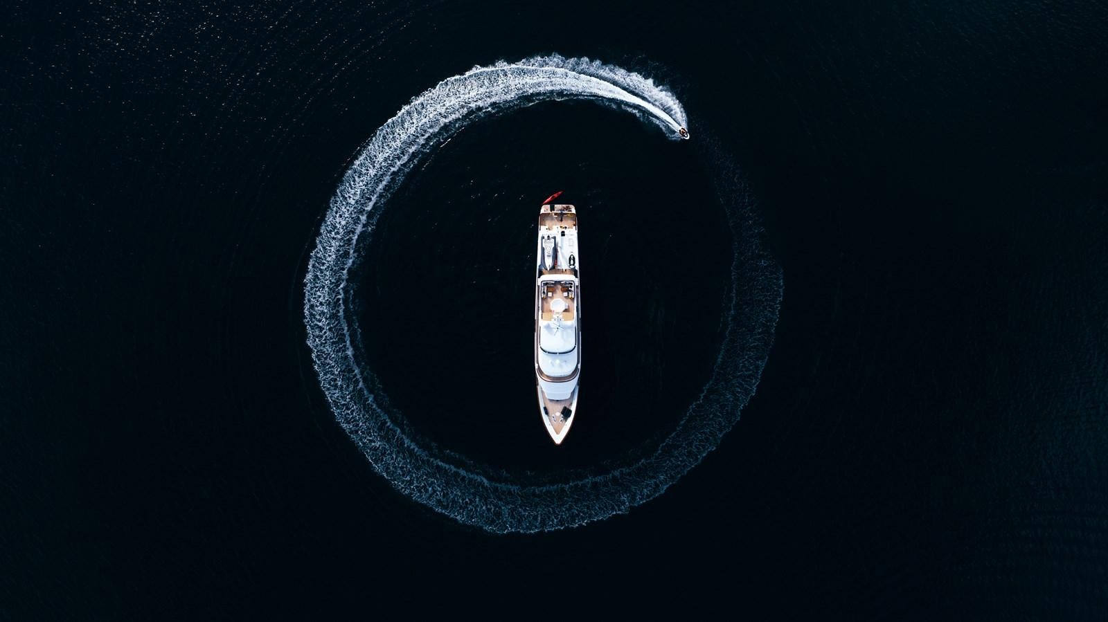 a white and black vehicle aboard DAYDREAM Yacht for Sale