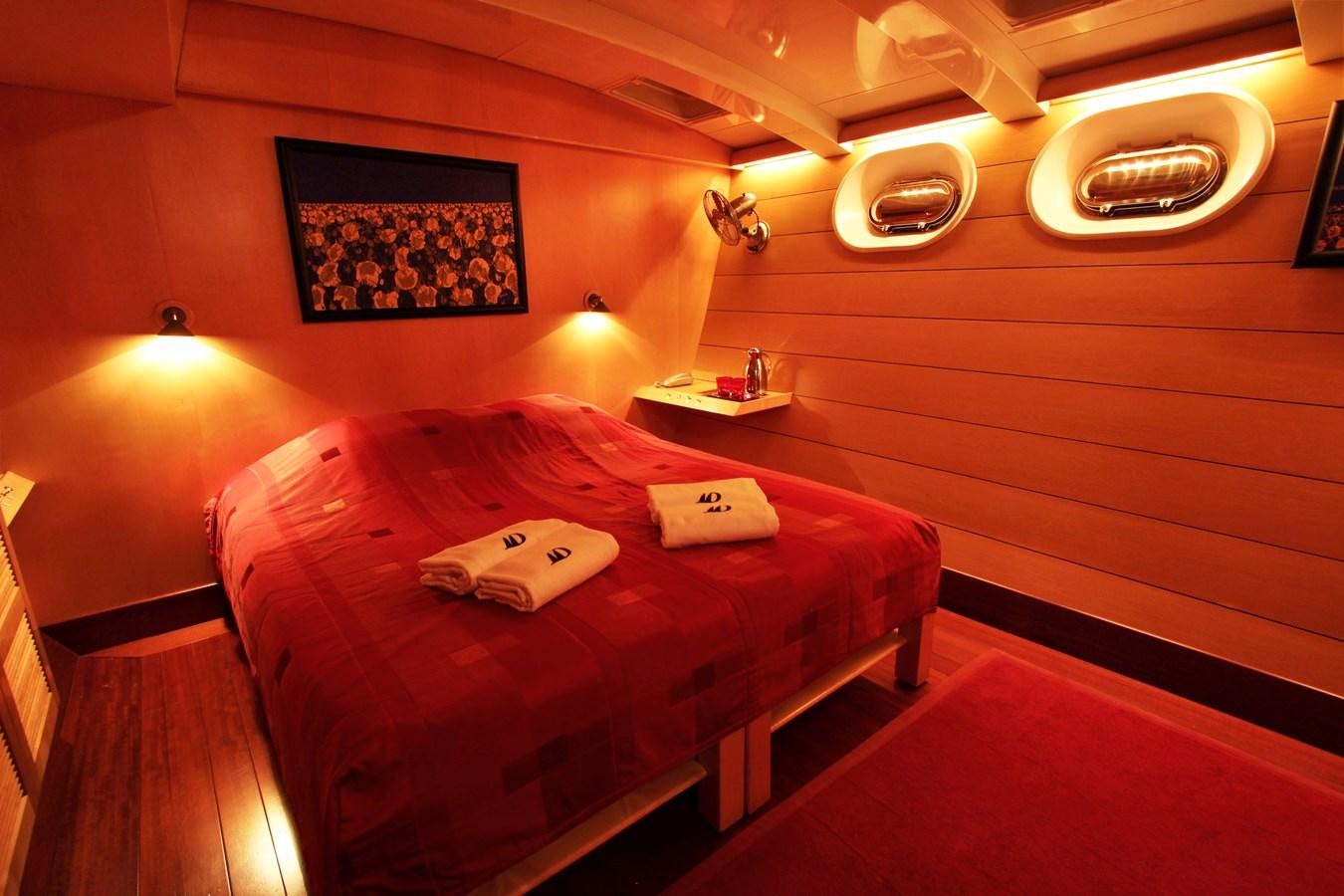 a bed in a room aboard DOUCE FRANCE Yacht for Sale