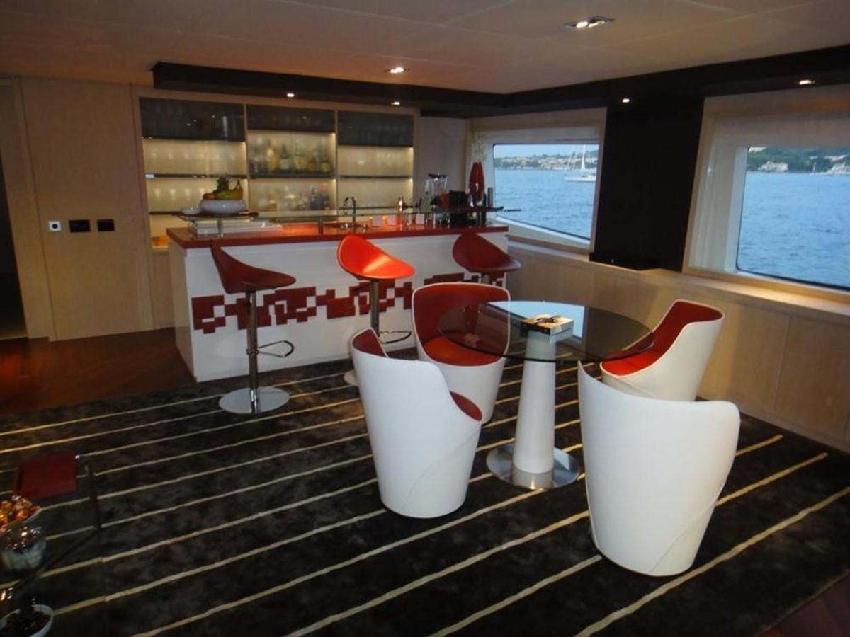 a room with chairs and tables aboard BLUE EAST Yacht for Sale