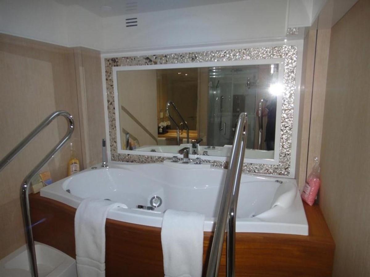 a bathroom with a large mirror aboard BLUE EAST Yacht for Sale