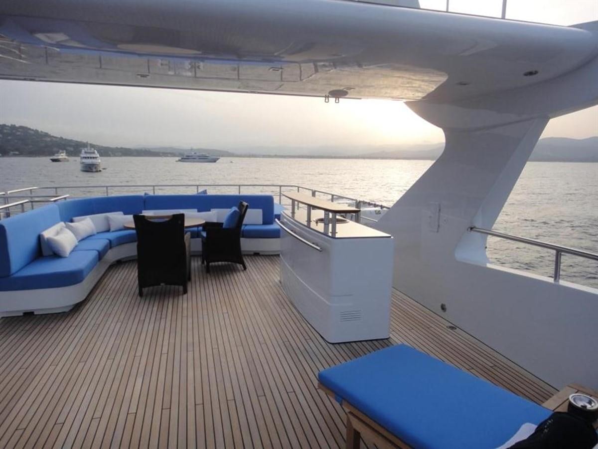 a room with a couch and a table and chairs aboard BLUE EAST Yacht for Sale