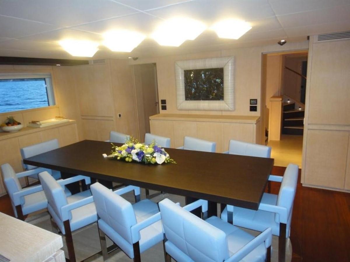 a room with a table and chairs aboard BLUE EAST Yacht for Sale