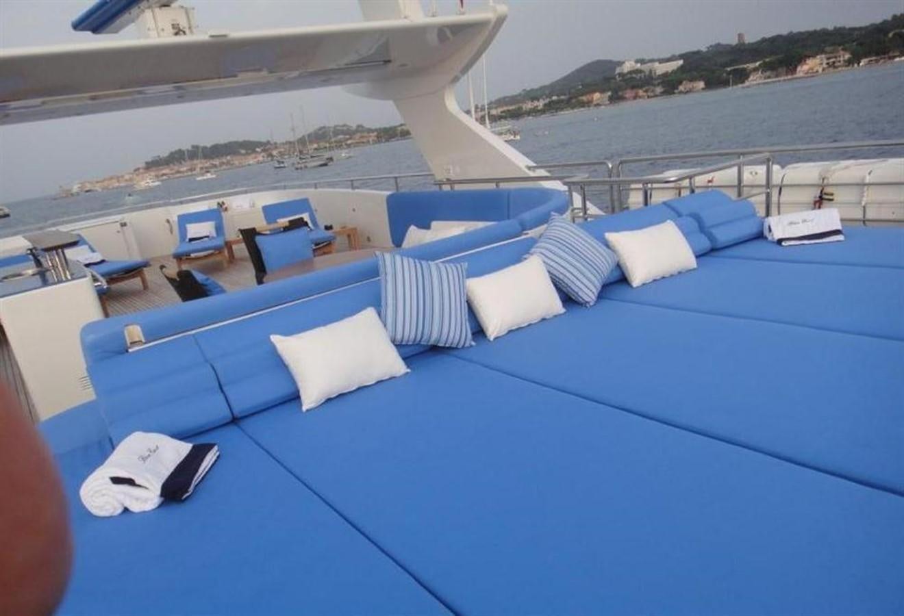 a laptop on a lounge chair aboard BLUE EAST Yacht for Sale