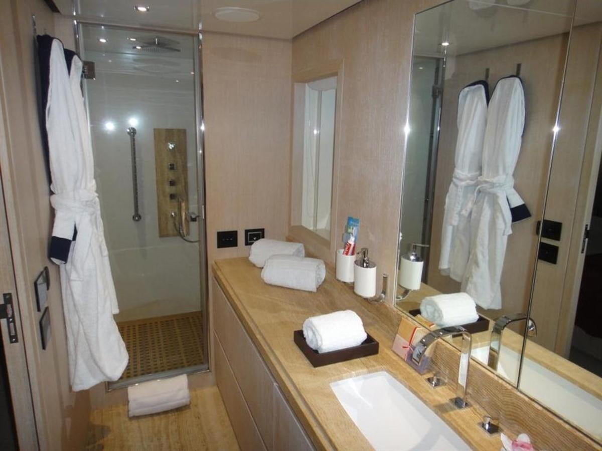 a bathroom with a large mirror aboard BLUE EAST Yacht for Sale