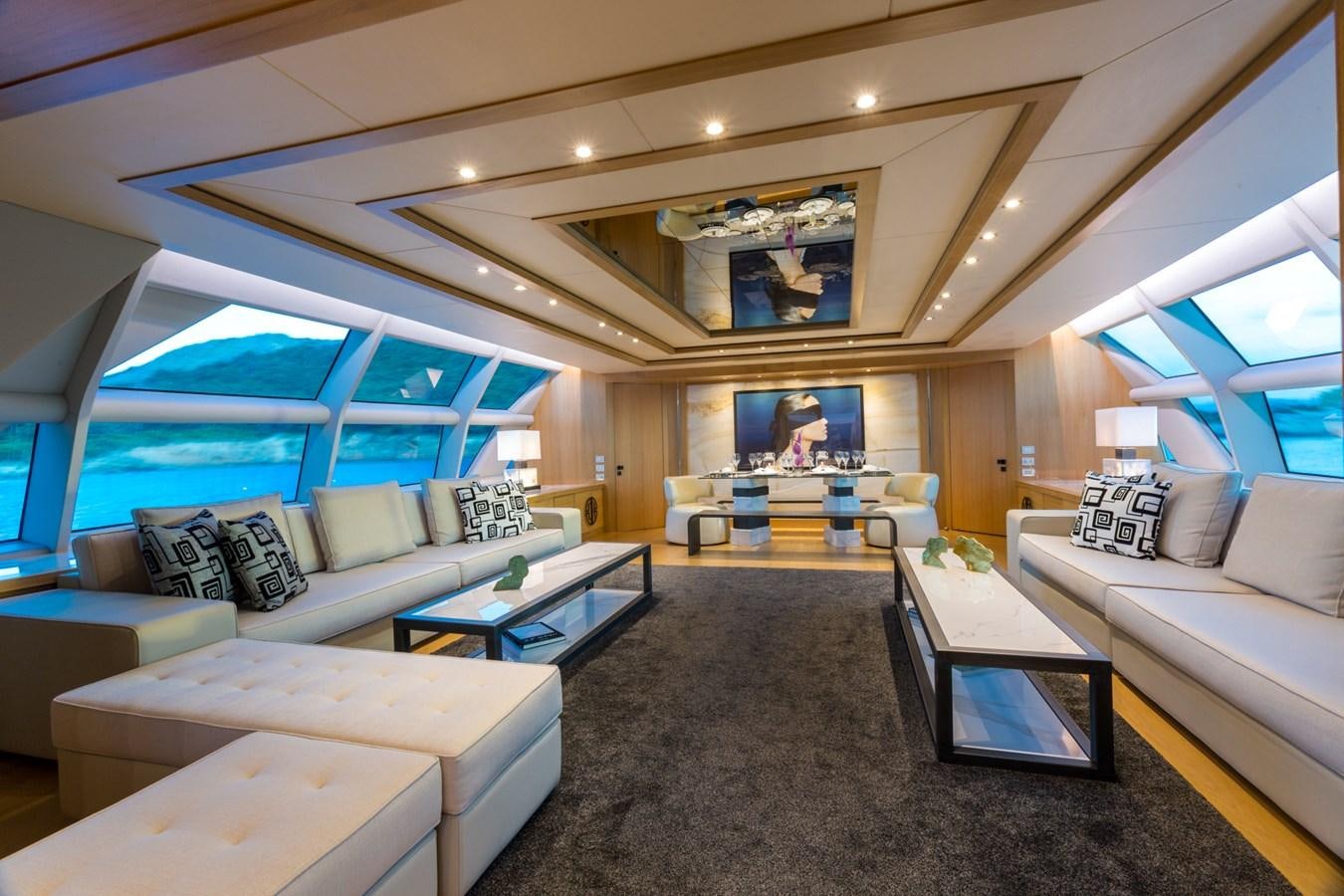 a living room with a large window aboard AQUARELLA Yacht for Sale