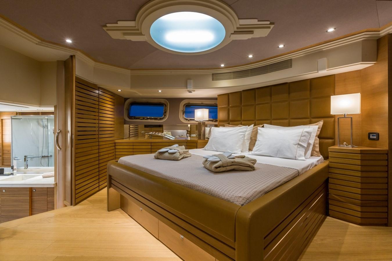 a room with a bed and a desk aboard AQUARELLA Yacht for Charter