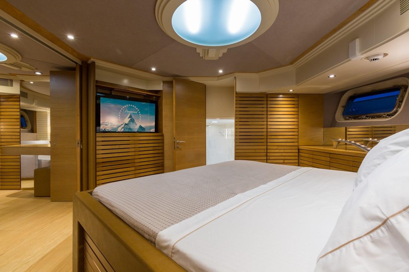 a room with a bed and a tv aboard AQUARELLA Yacht for Sale