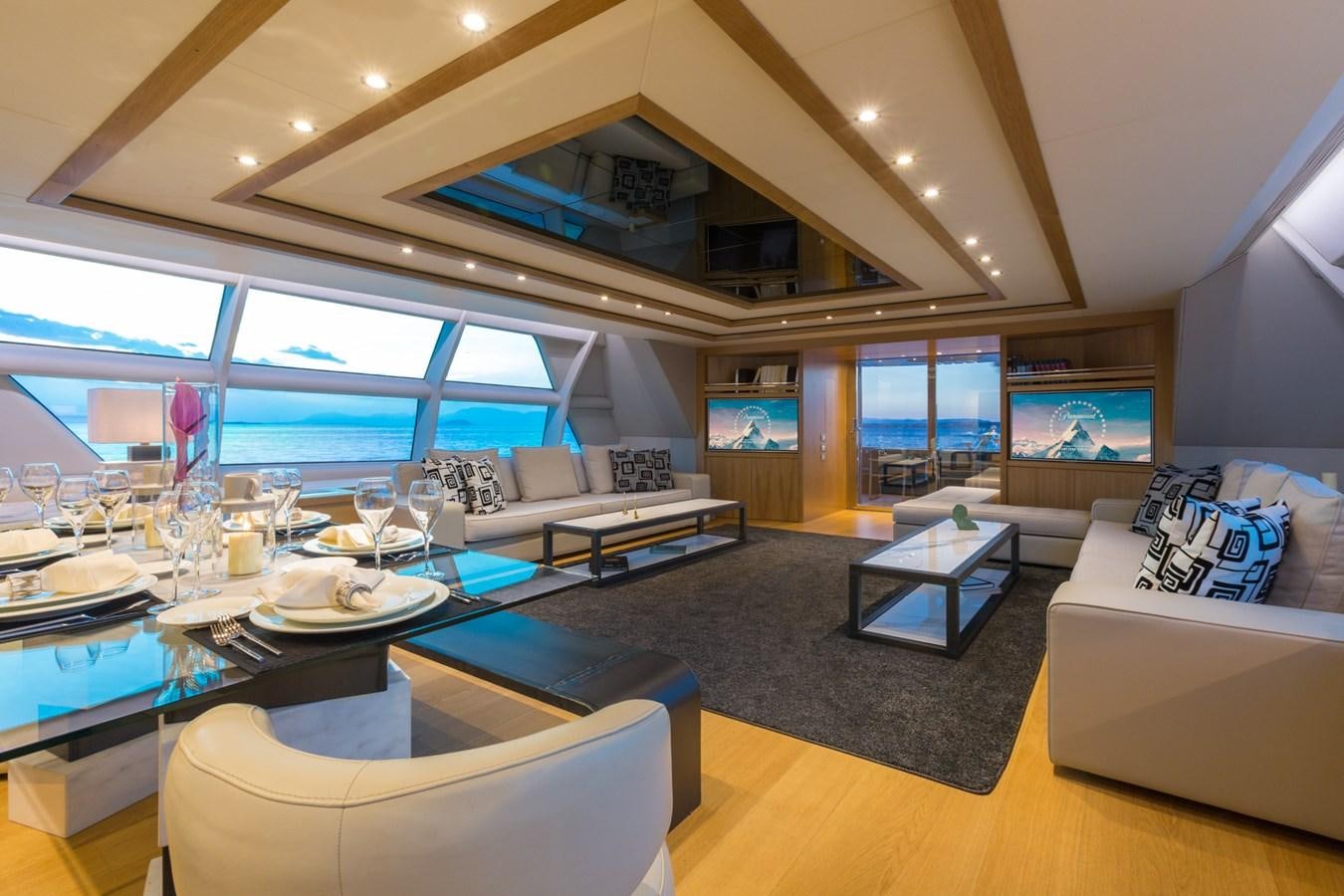 a living room with a large window aboard AQUARELLA Yacht for Charter