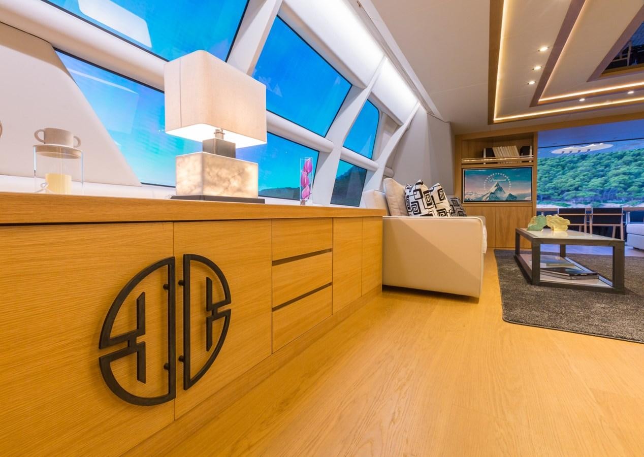 a room with a wood floor and a wood floor and a large window aboard AQUARELLA Yacht for Sale