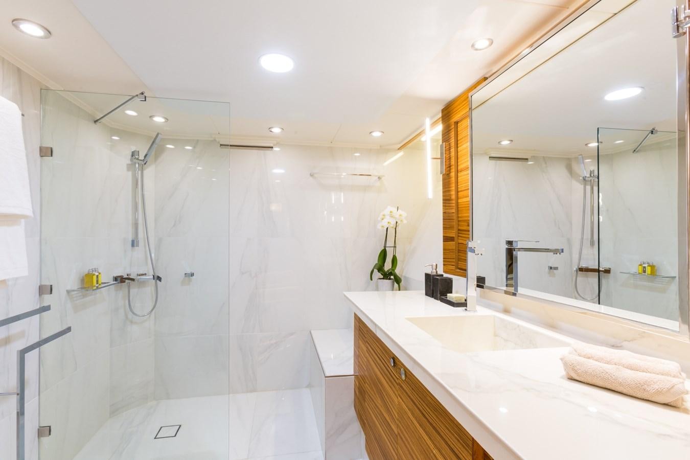 a bathroom with a shower and sink aboard AQUARELLA Yacht for Sale