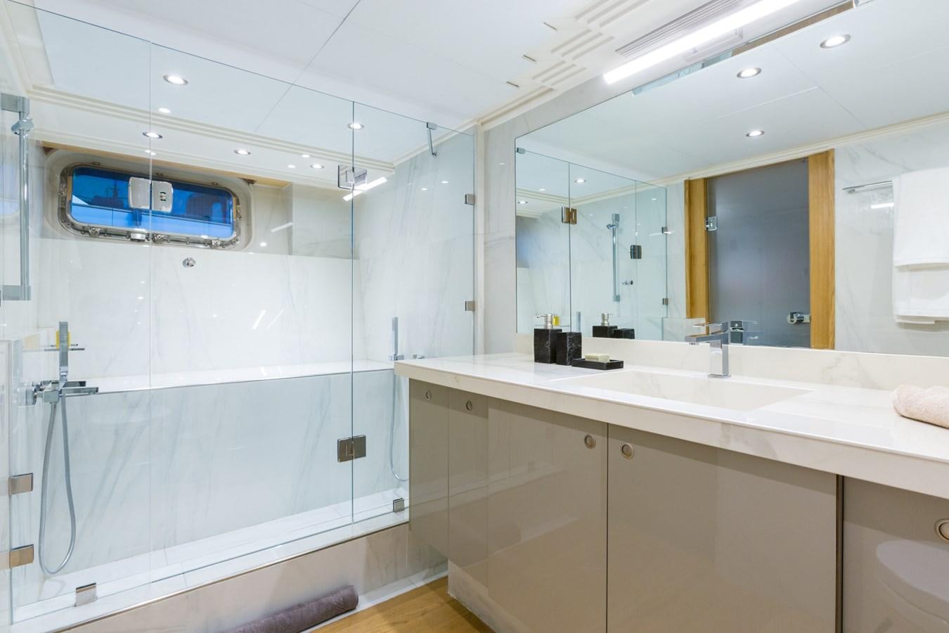 a bathroom with a large mirror aboard AQUARELLA Yacht for Sale