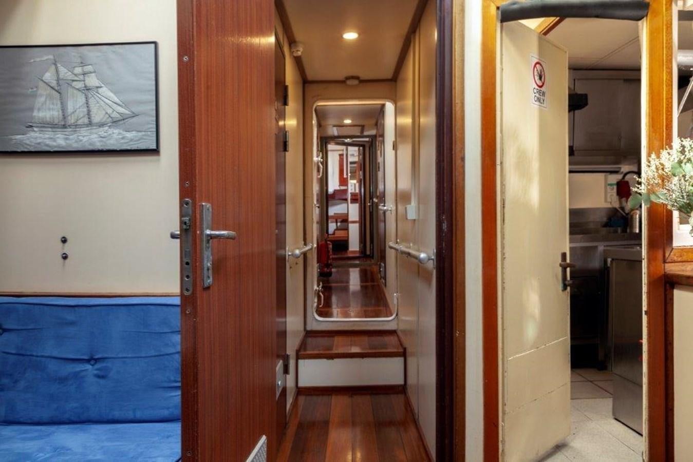 a hallway with doors aboard SIR ROBERT BADEN POWELL Yacht for Sale