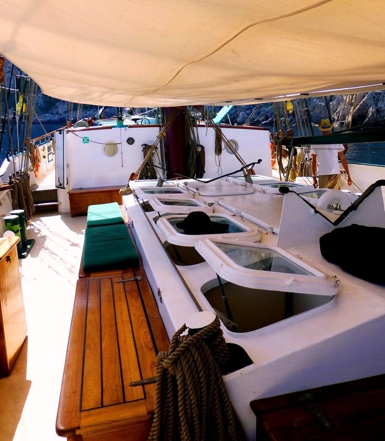 a boat is parked in a harbor aboard SIR ROBERT BADEN POWELL Yacht for Sale