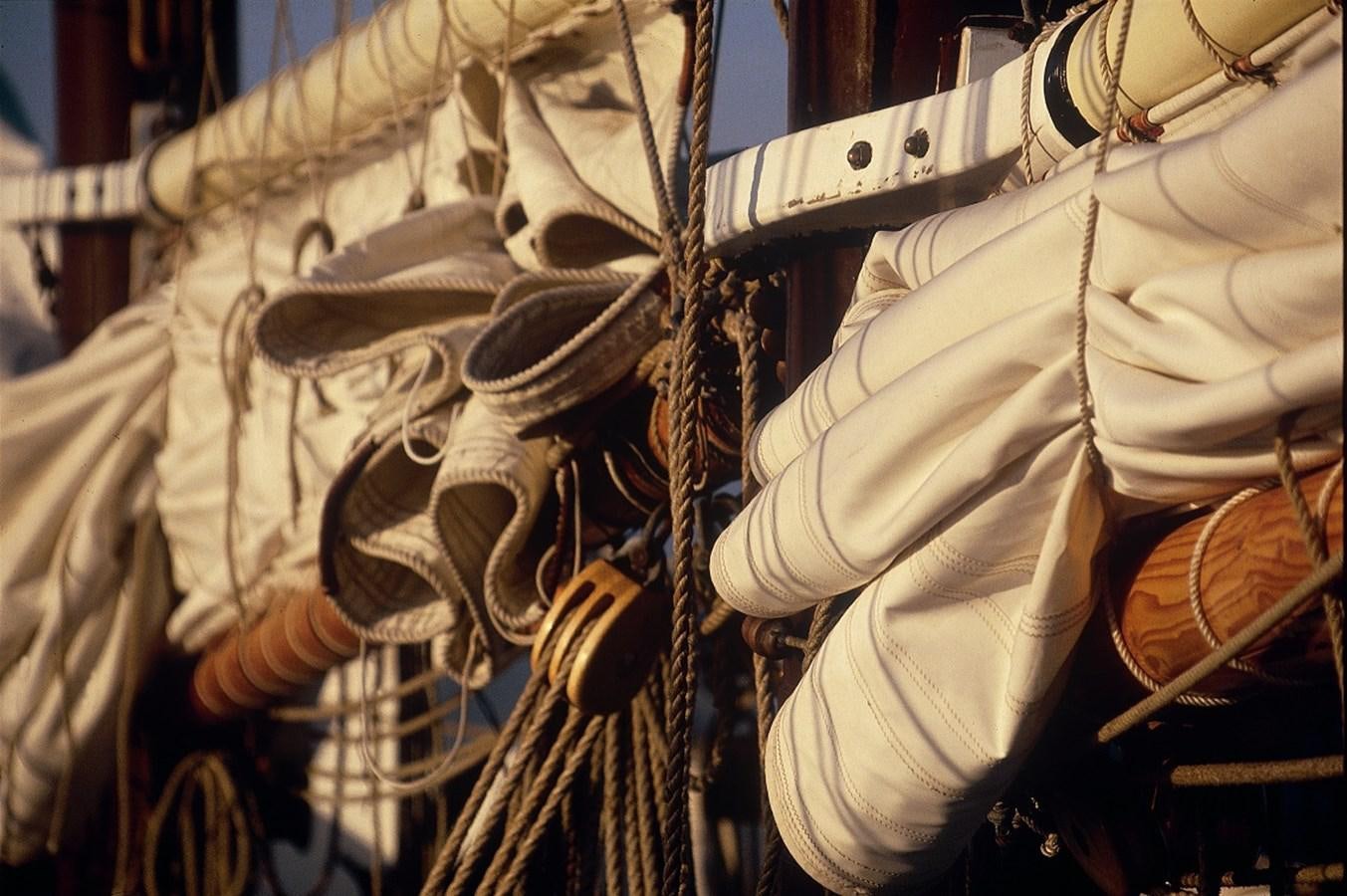 a group of white gloves aboard SIR ROBERT BADEN POWELL Yacht for Sale