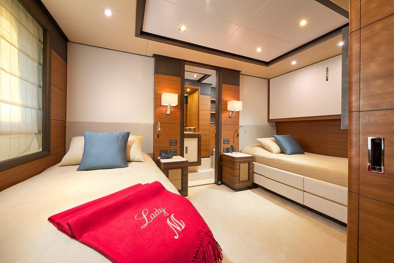 a hotel room with a bed and a desk aboard LADY MRD Yacht for Charter