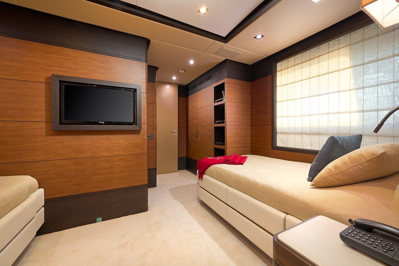 a room with a bed and a tv aboard LADY MRD Yacht for Charter