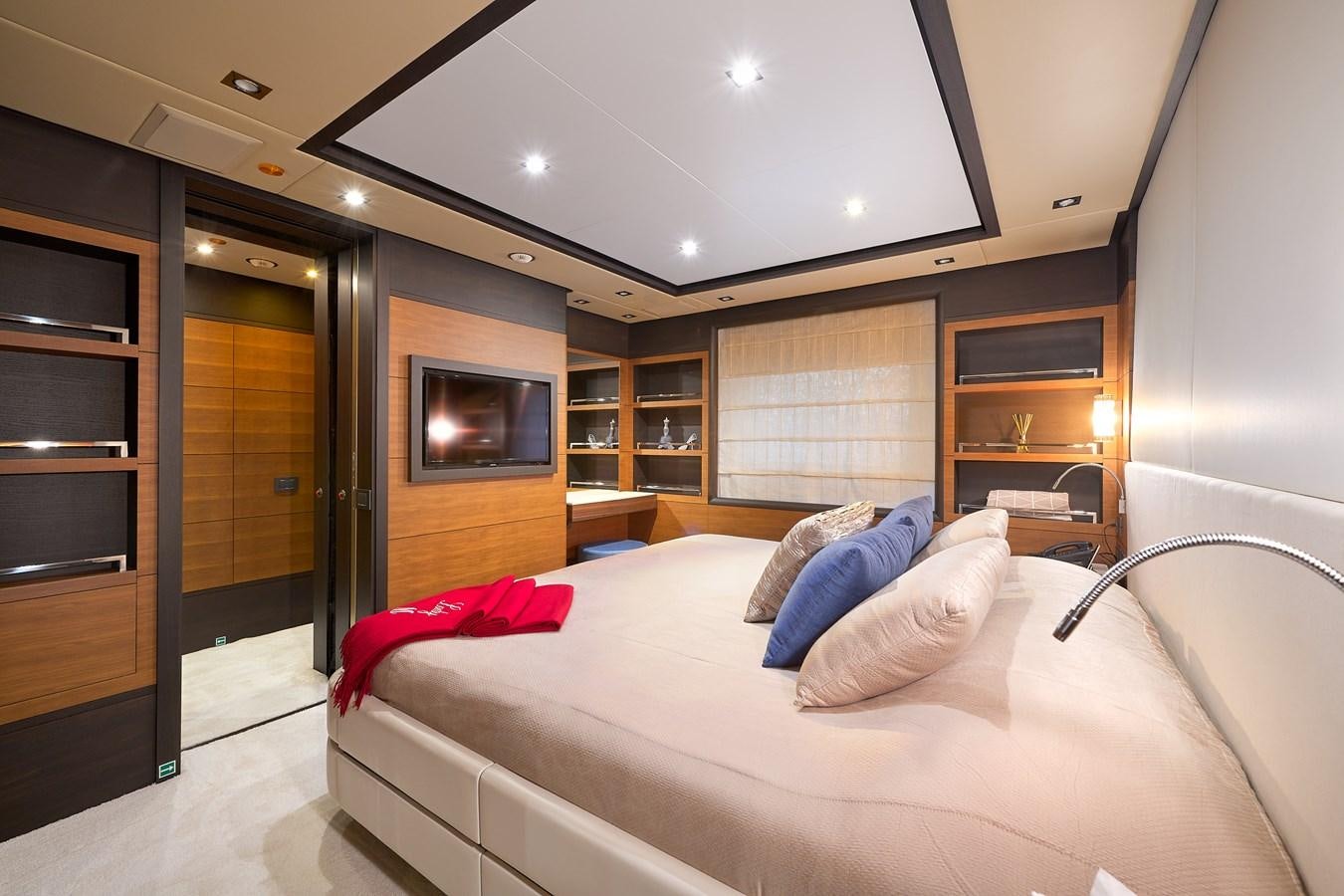 a room with a bed and a tv aboard LADY MRD Yacht for Charter