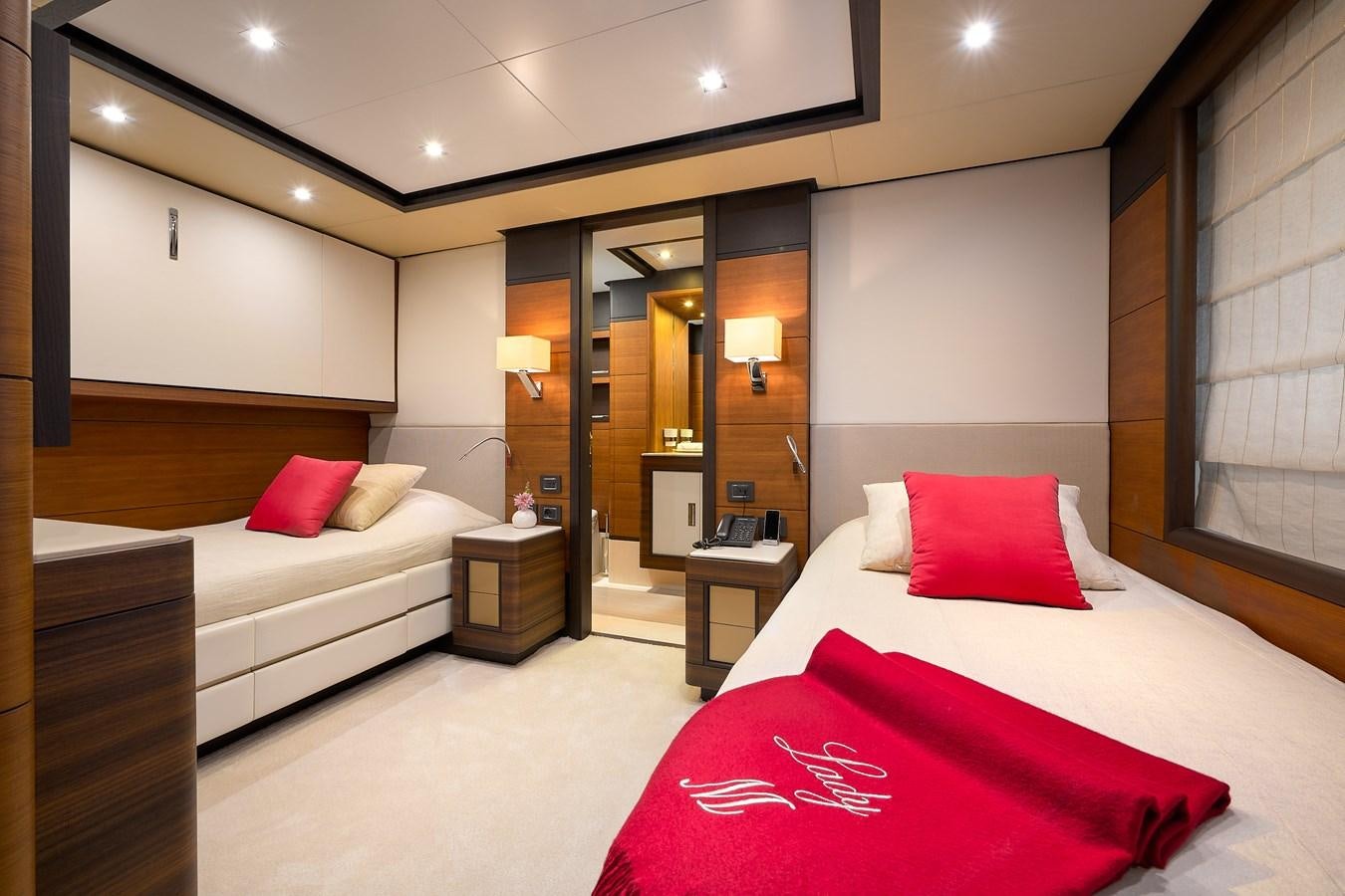a hotel room with two beds aboard LADY MRD Yacht for Charter