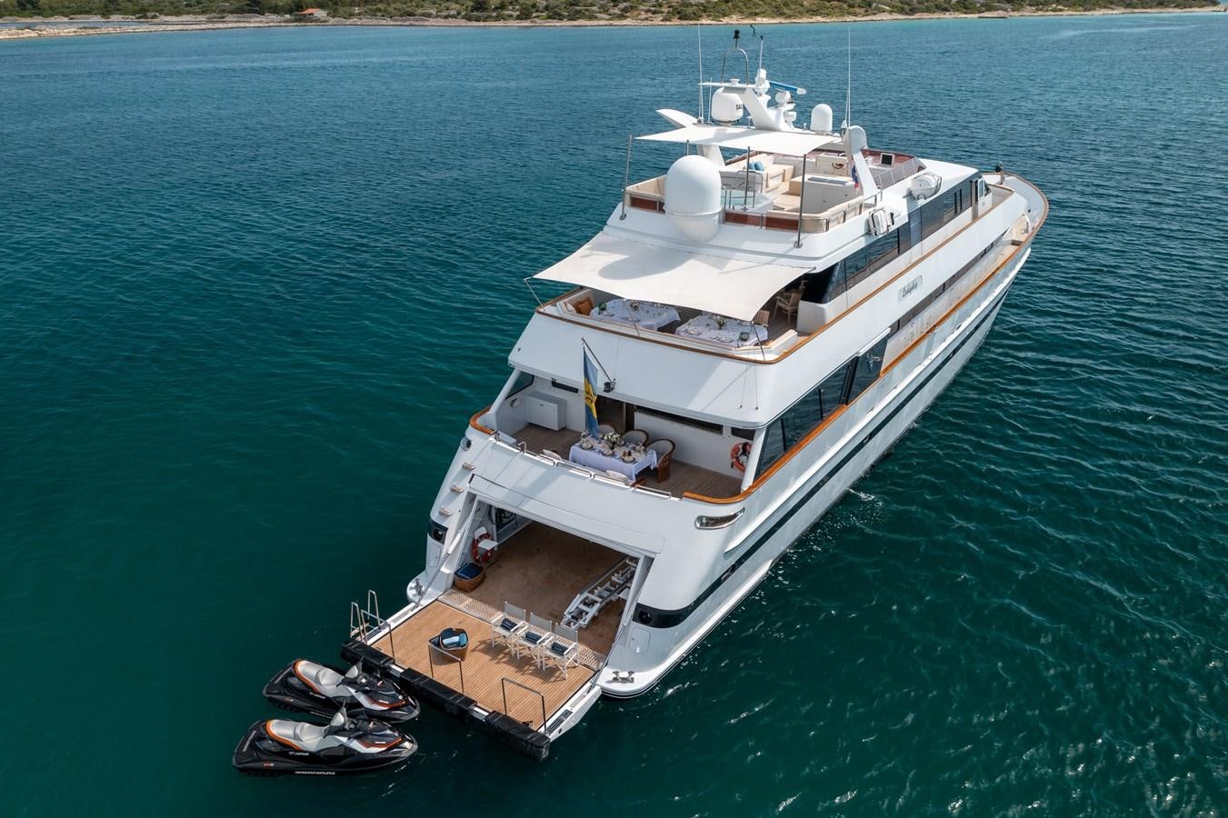 a large white ship on the water aboard LADYSHIP Yacht for Charter
