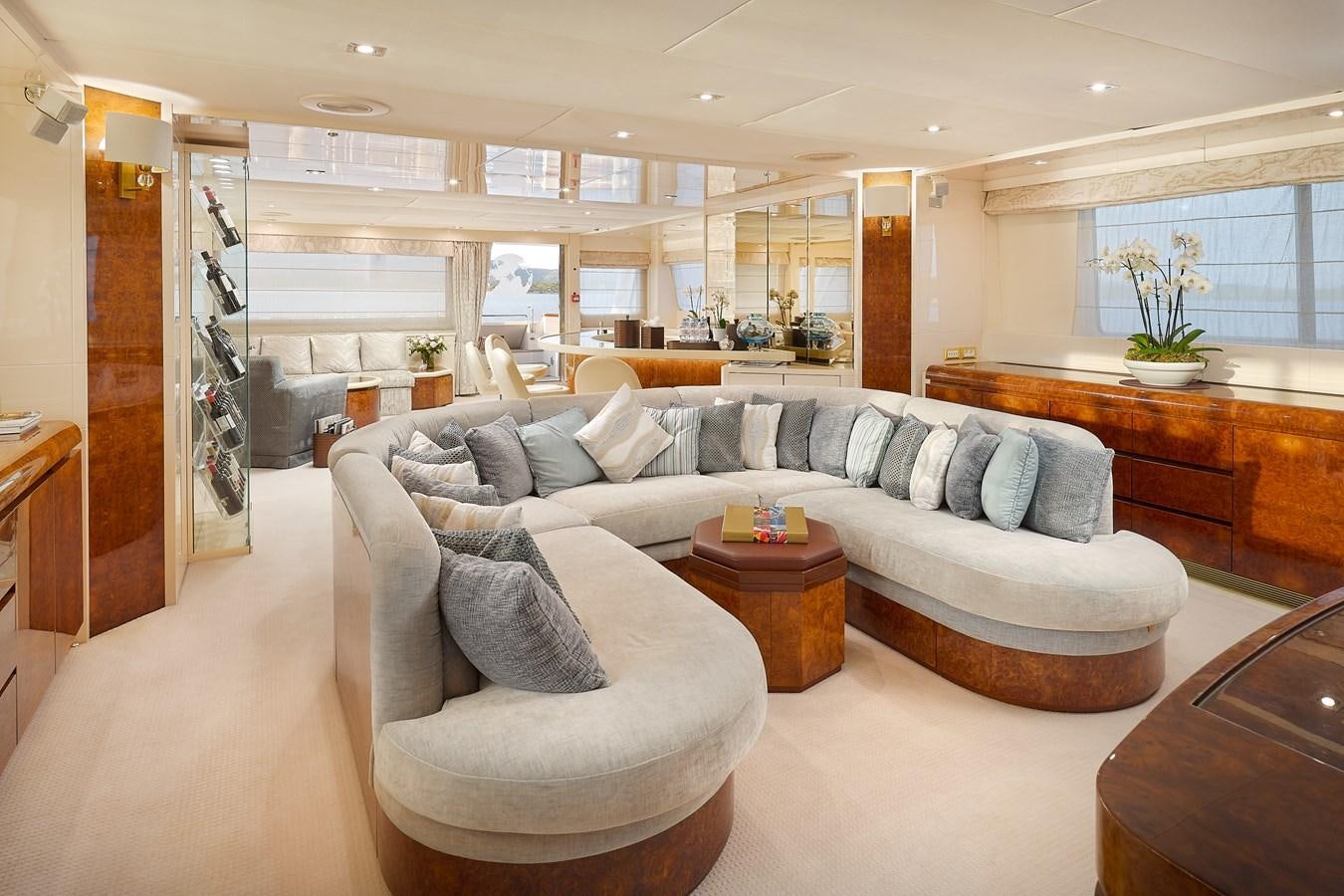 a living room with a couch and a coffee table aboard LADYSHIP Yacht for Sale