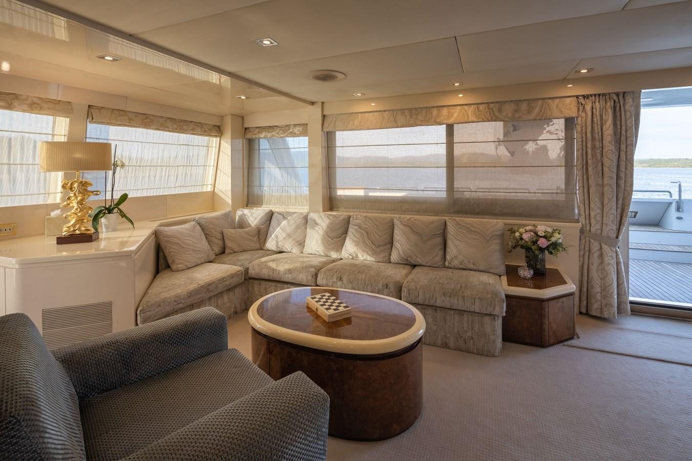 a living room with a couch and coffee table aboard LADYSHIP Yacht for Charter