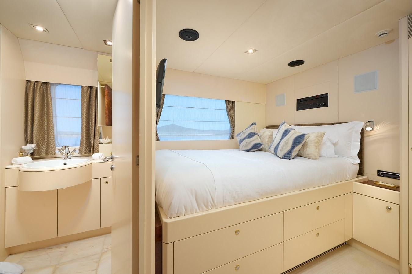 a bedroom with a bed and sink aboard LADYSHIP Yacht for Charter