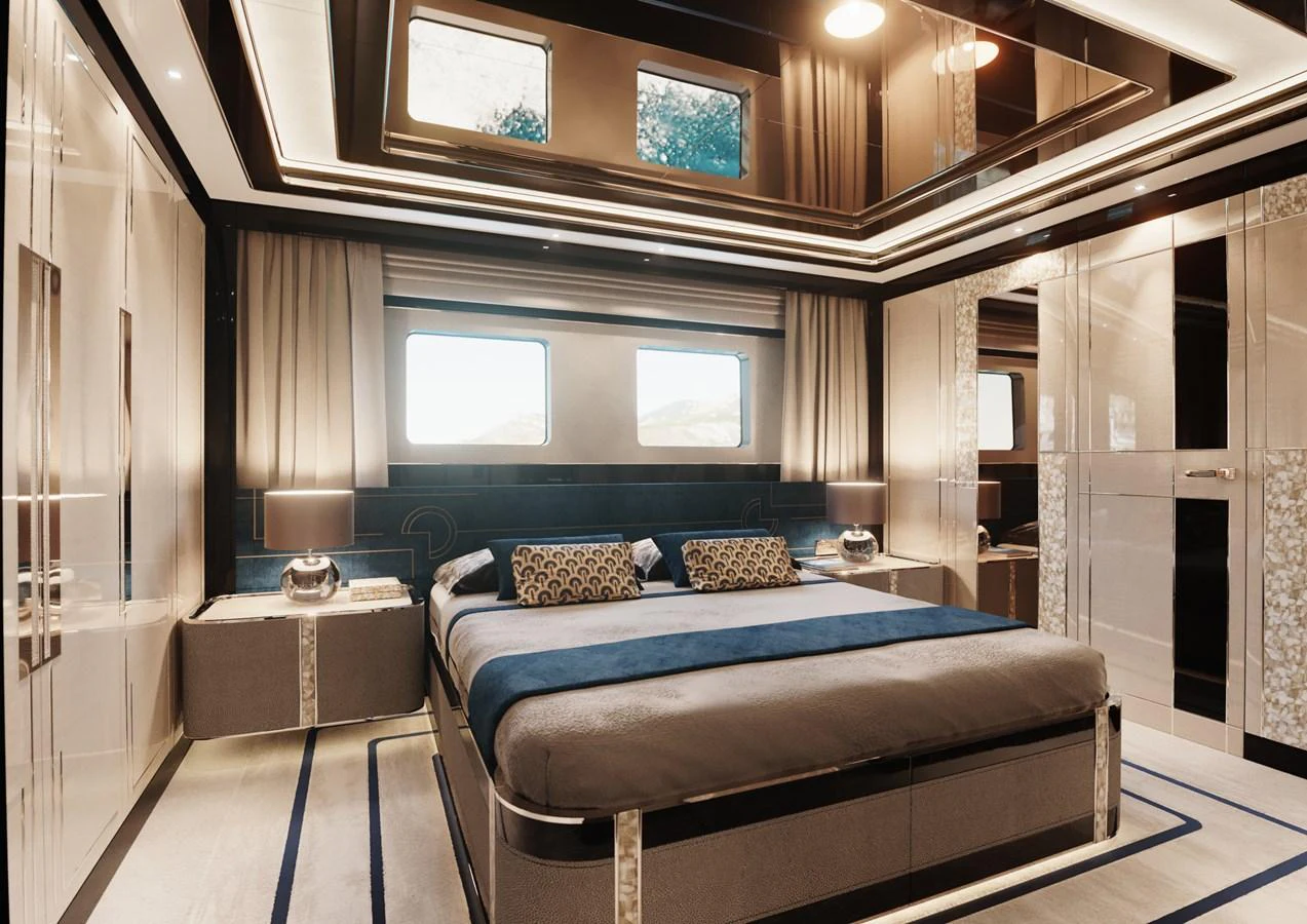 a large bedroom with a bed aboard DYNAMIQ GTT135 Yacht for Sale