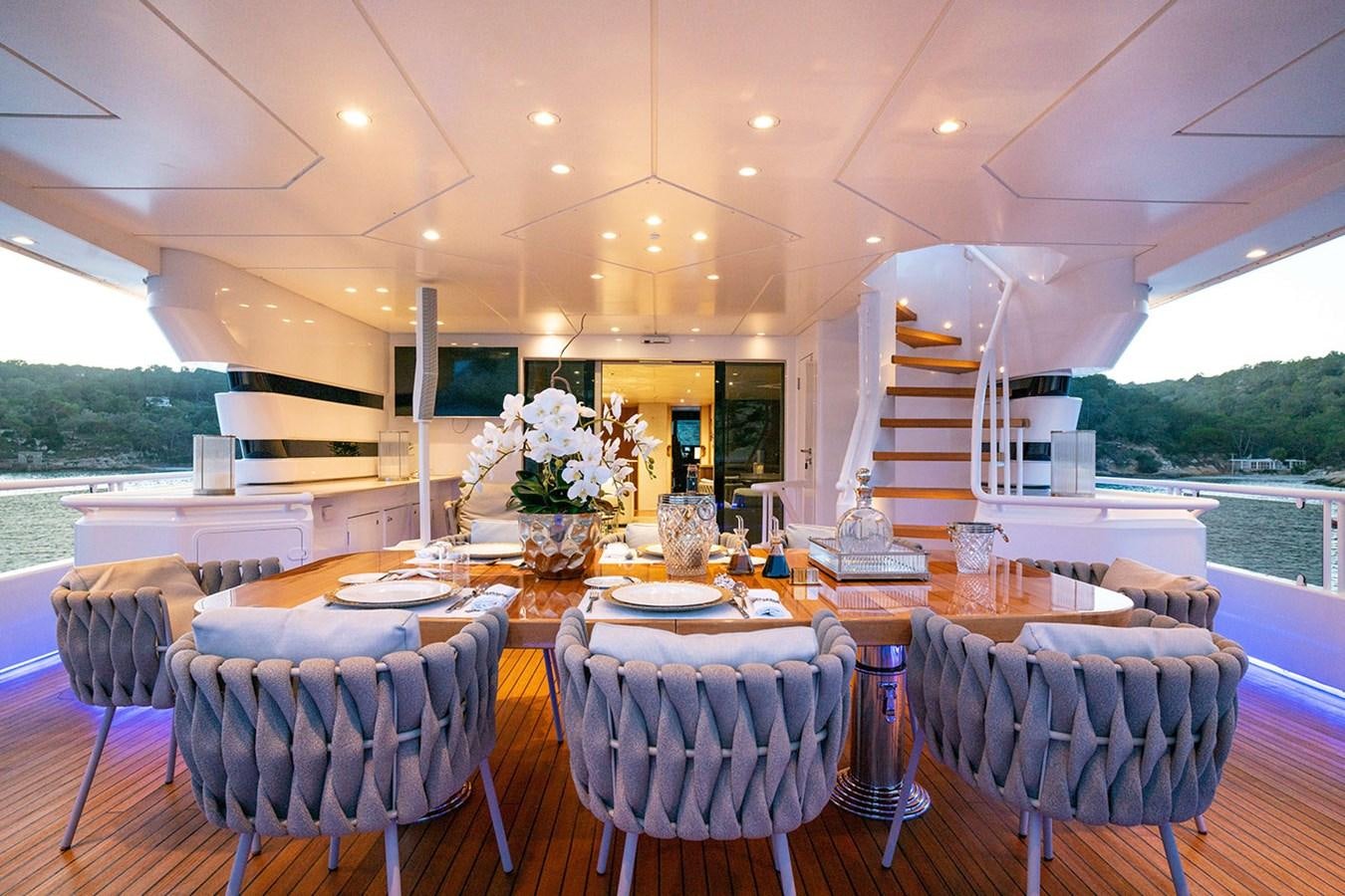 a table set for a wedding reception aboard ENVY Yacht for Sale