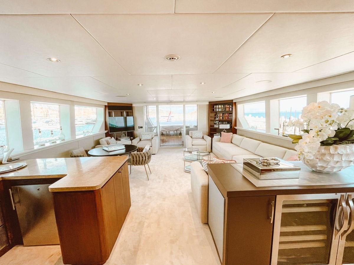 a room with a desk and chairs aboard ENVY Yacht for Sale