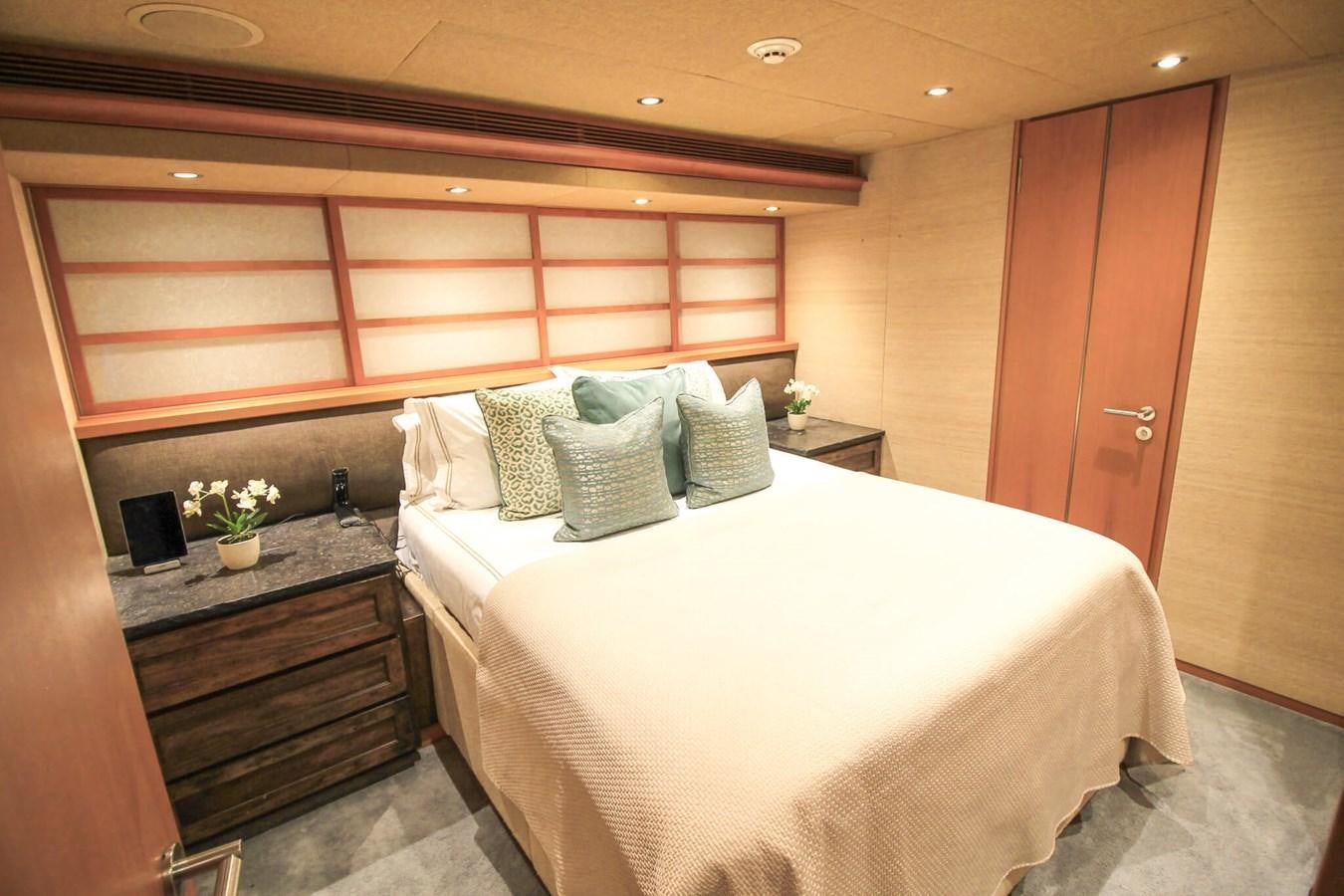 a bed in a room aboard ENVY Yacht for Sale