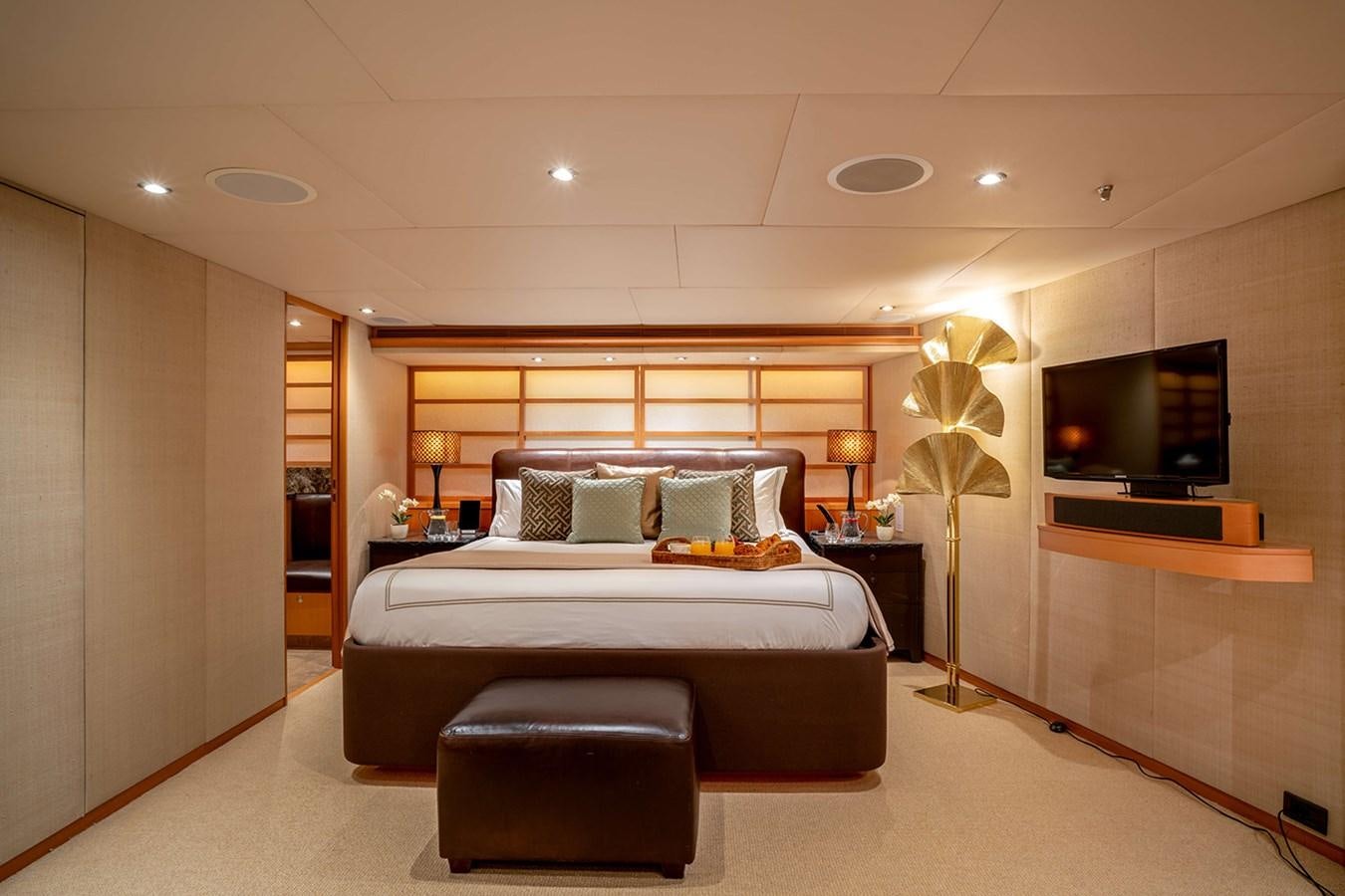 a large bedroom with a large bed aboard ENVY Yacht for Sale