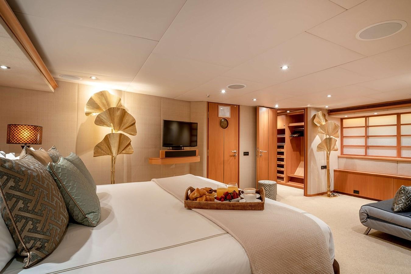 a large bedroom with a large bed aboard ENVY Yacht for Sale