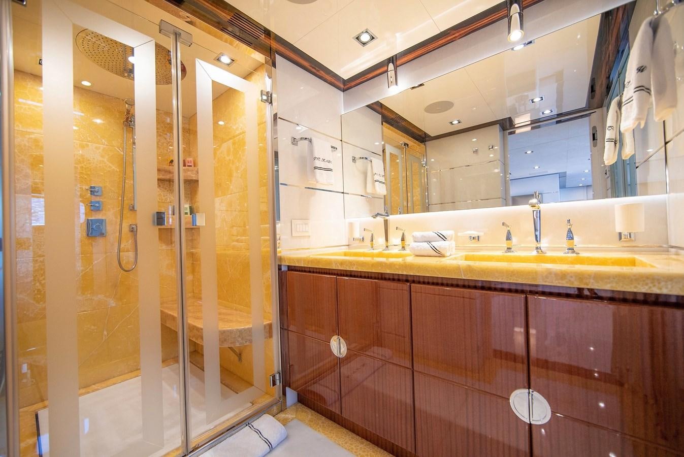 a bathroom with a glass shower aboard MAESTRO Yacht for Sale