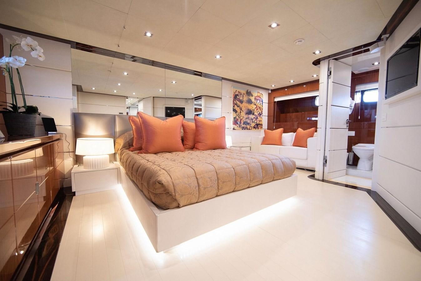 a large bed in a room aboard MAESTRO Yacht for Sale