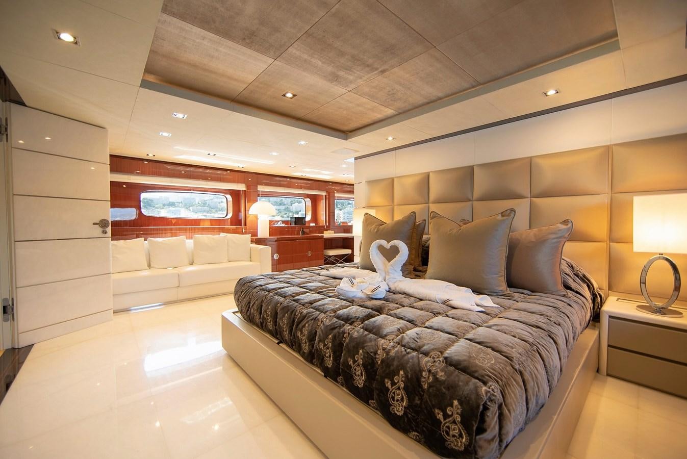 a large bed in a room aboard MAESTRO Yacht for Sale