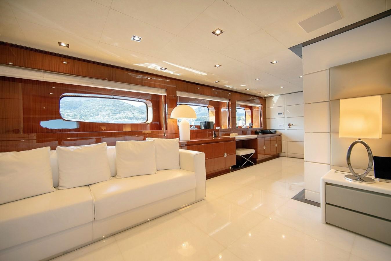 a living room with a couch and a television aboard MAESTRO Yacht for Sale