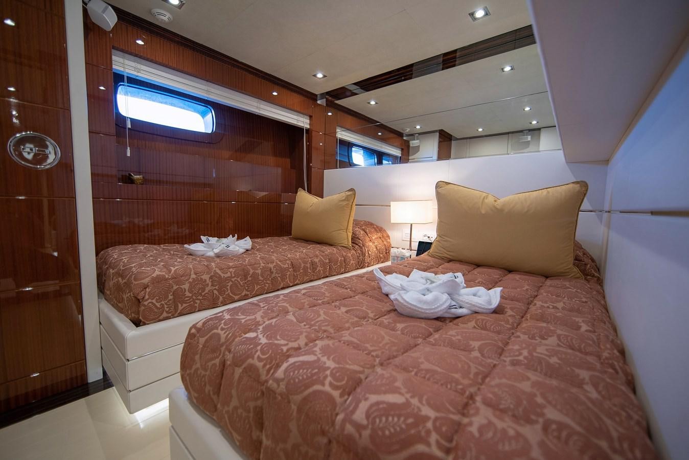 a room with a bed and a window aboard MAESTRO Yacht for Sale