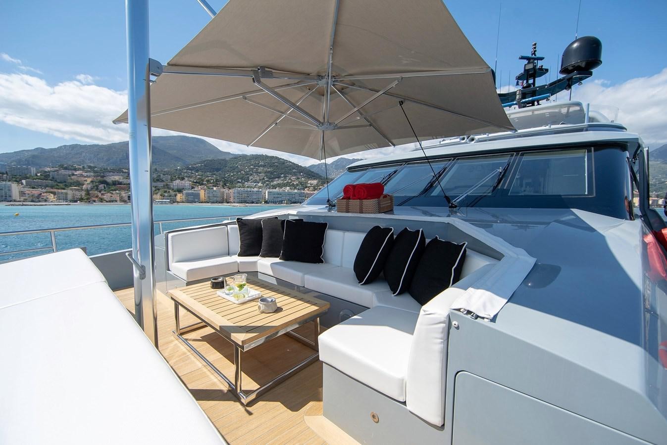 a boat with a table and chairs on the deck aboard MAESTRO Yacht for Sale
