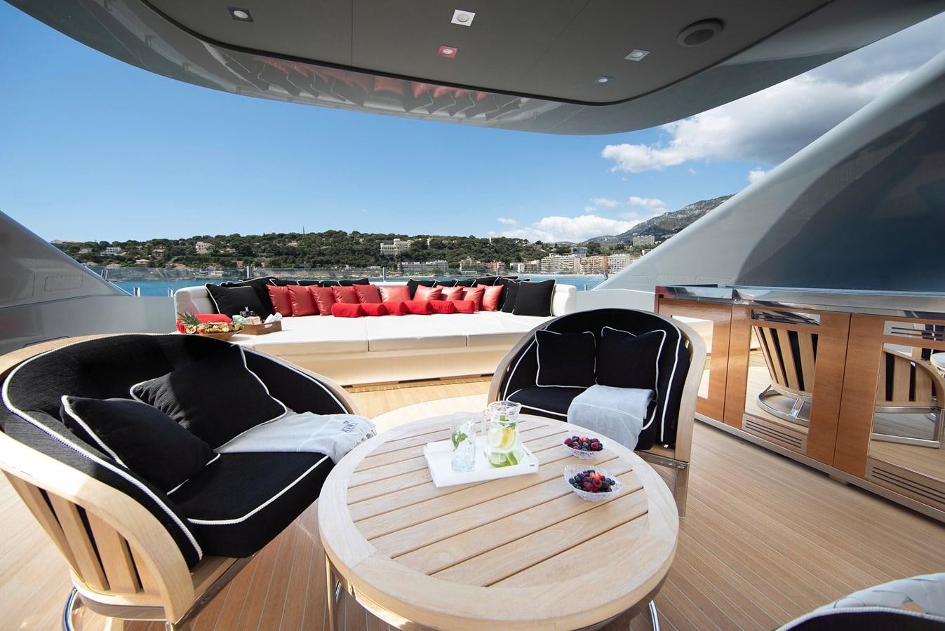 a room with a table and chairs aboard MAESTRO Yacht for Sale