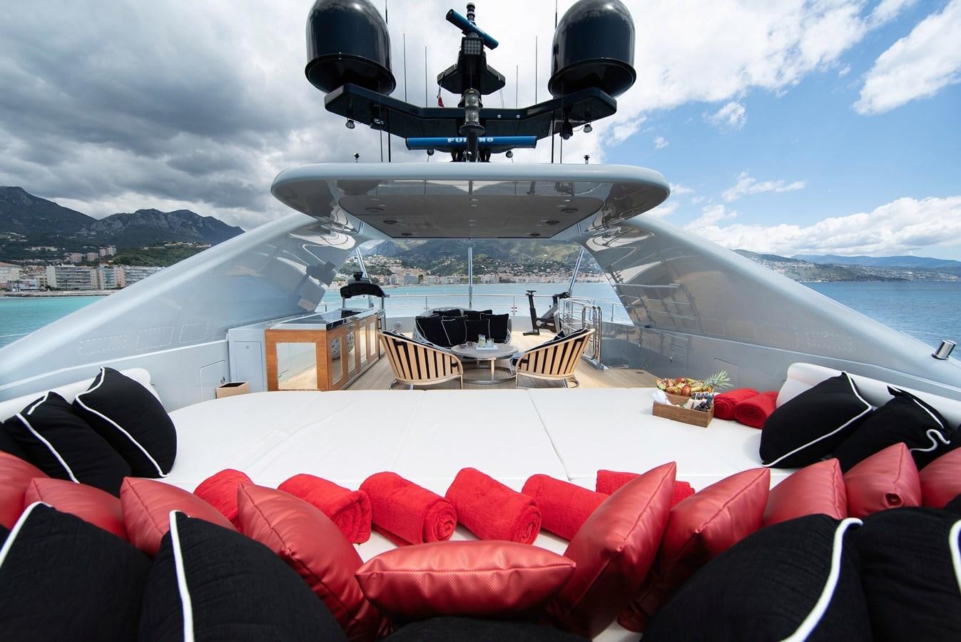 a group of chairs and a helicopter on a deck aboard MAESTRO Yacht for Sale