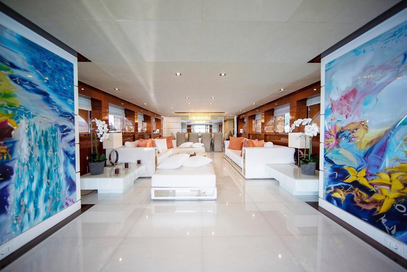 a large room with white furniture aboard MAESTRO Yacht for Sale
