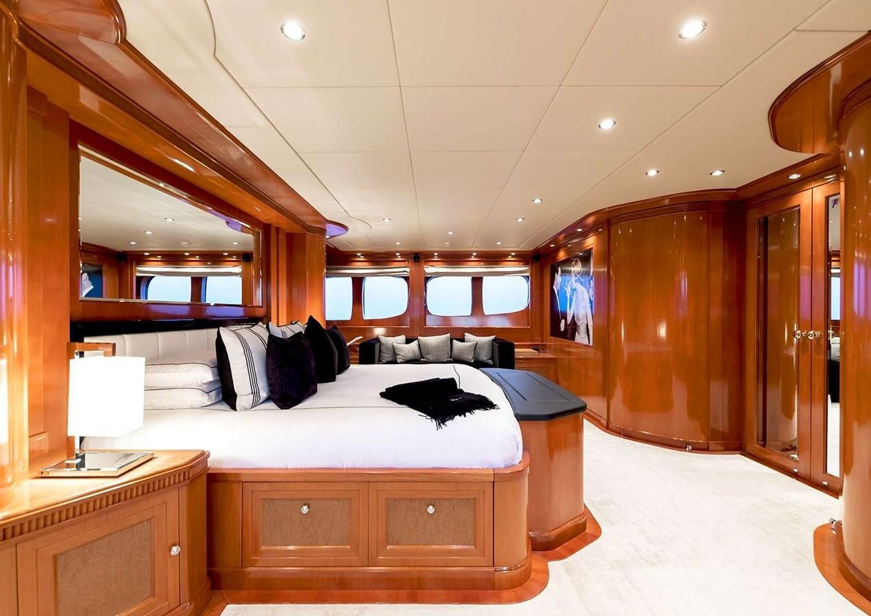 a room with a bed and a mirror aboard MY WAY V Yacht for Sale