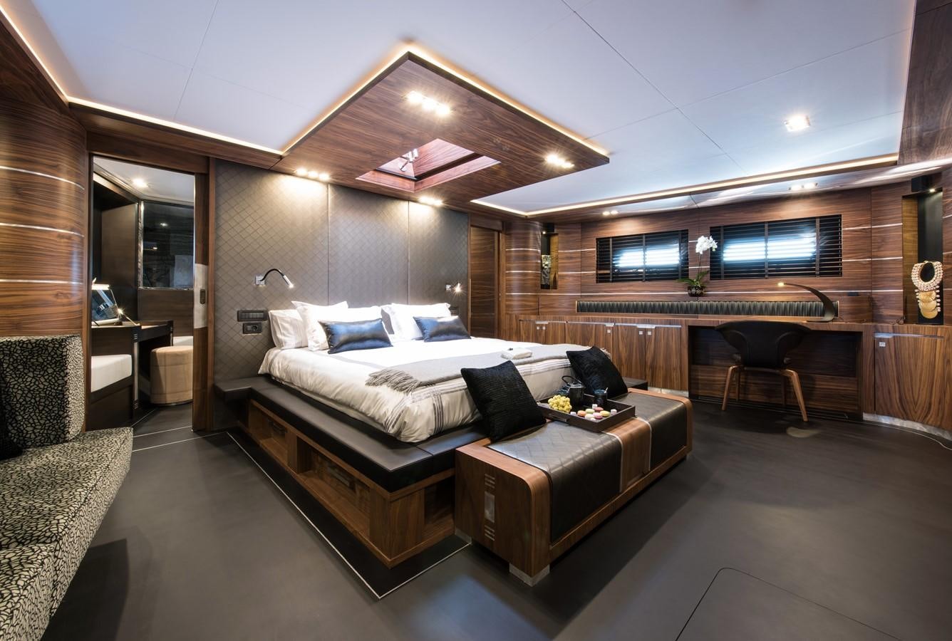a large bedroom with a large bed aboard ROX STAR Yacht for Charter