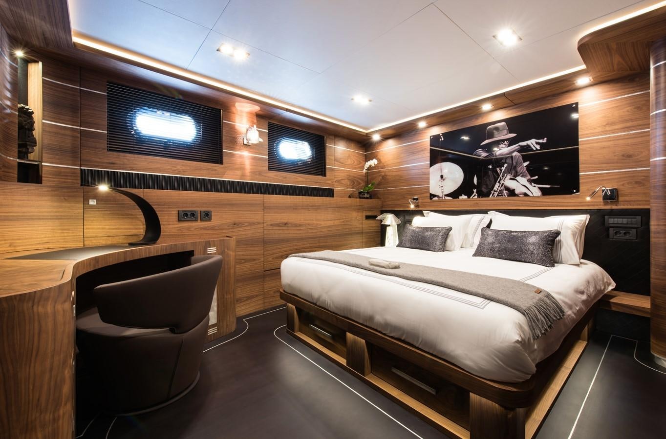 a room with a bed and a tv aboard ROX STAR Yacht for Charter