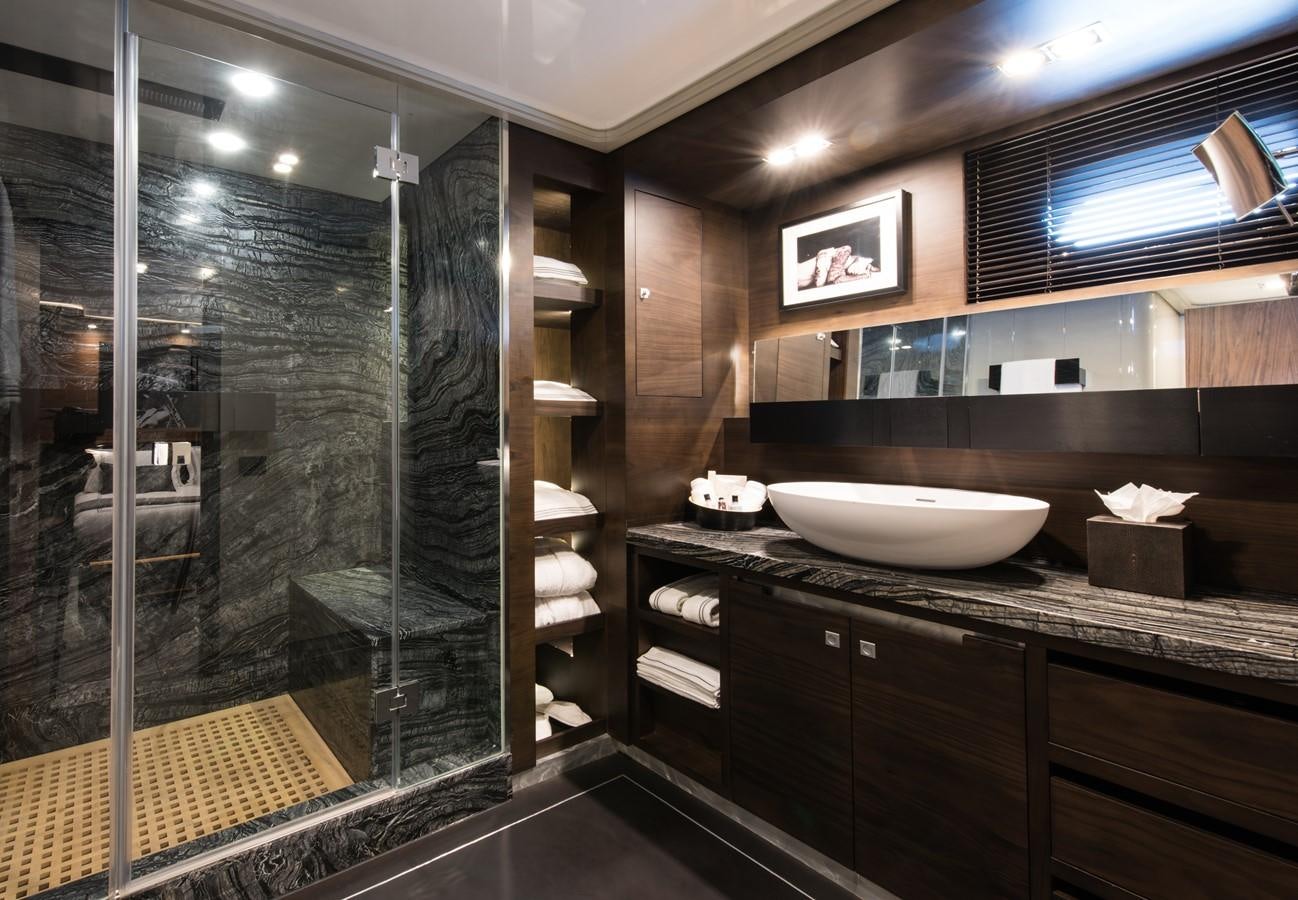 a bathroom with a sink and a mirror aboard ROX STAR Yacht for Charter