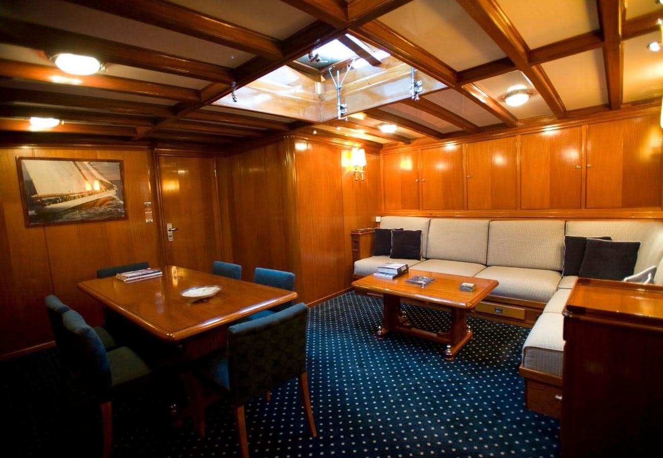 a room with a couch and a table aboard CANDIDA Yacht for Sale