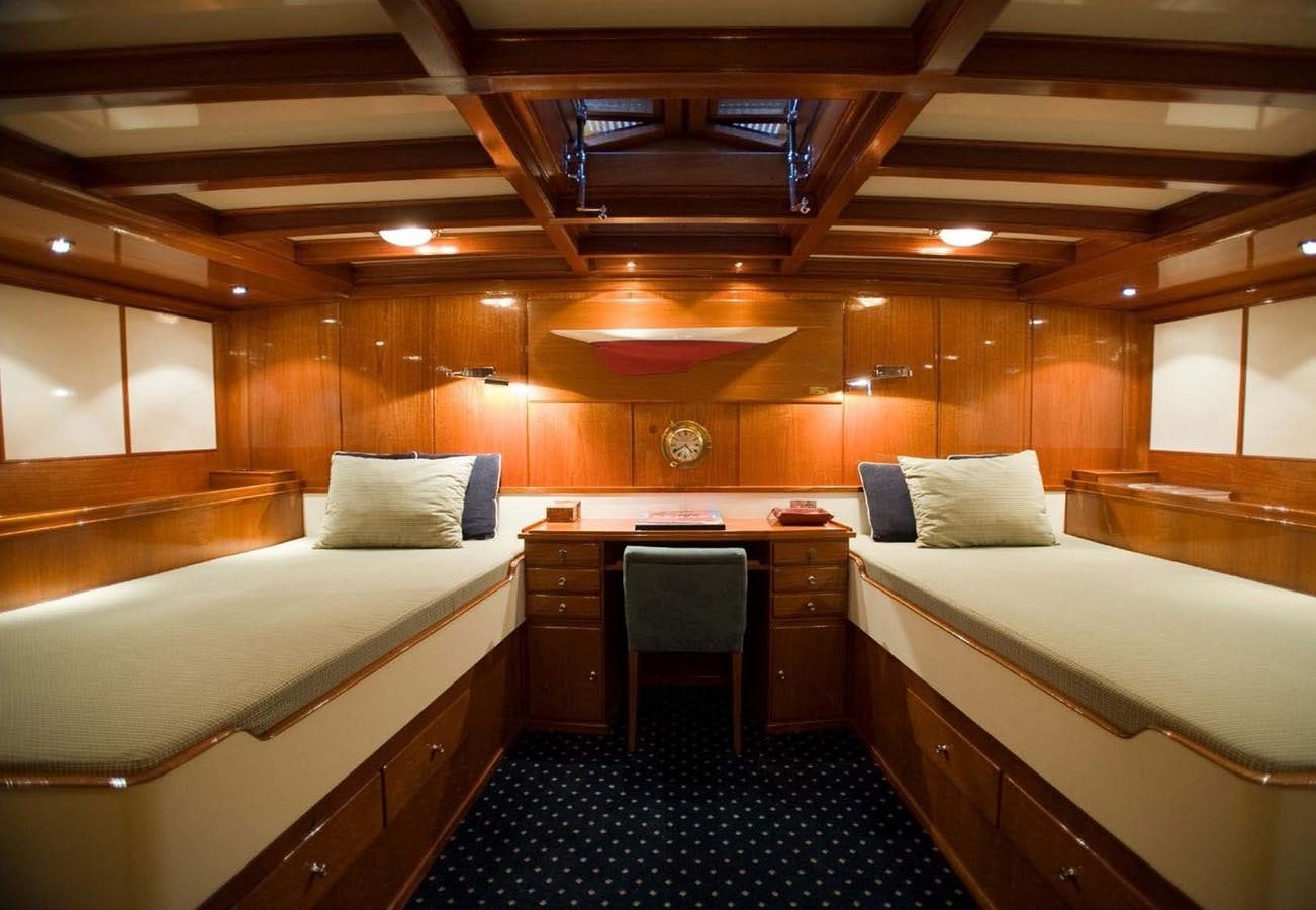 a room with a bed and a desk aboard CANDIDA Yacht for Sale