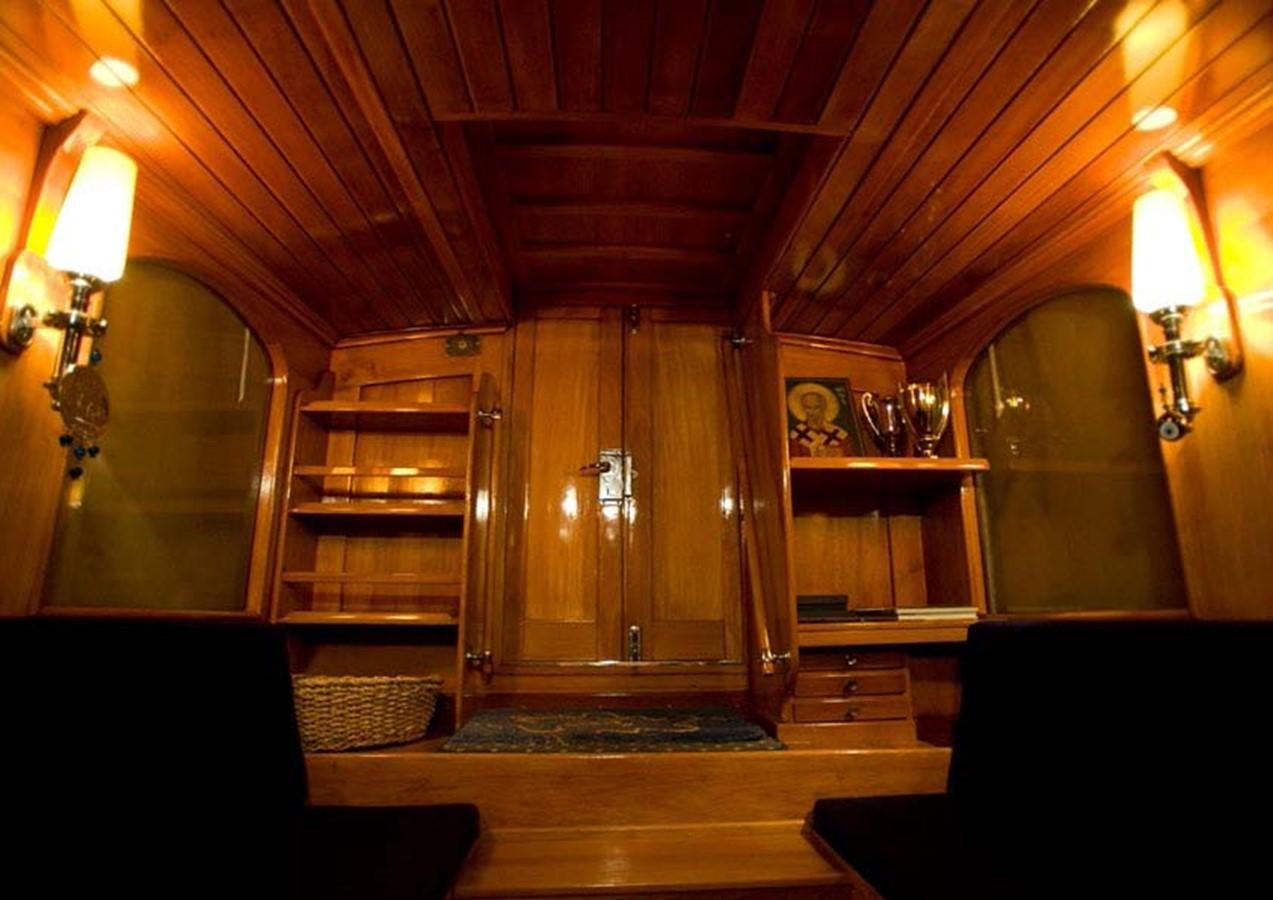 a room with a wood door and a wood cabinet aboard CANDIDA Yacht for Sale