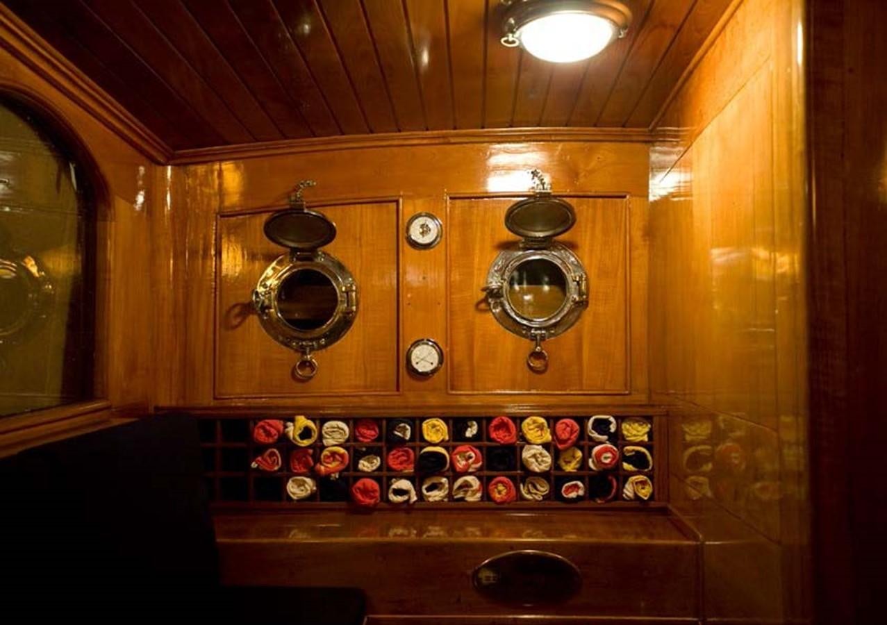 a wooden cabinet with knobs aboard CANDIDA Yacht for Sale